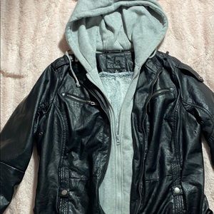 a black biker jacket , grey  hoodie , inside fur